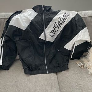 Black with white stripes adidas windbreaker. Men's large
